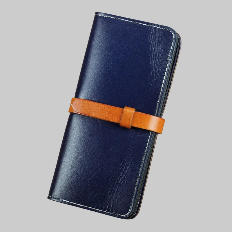 Blue leather wallet with a brown strap on a brown background