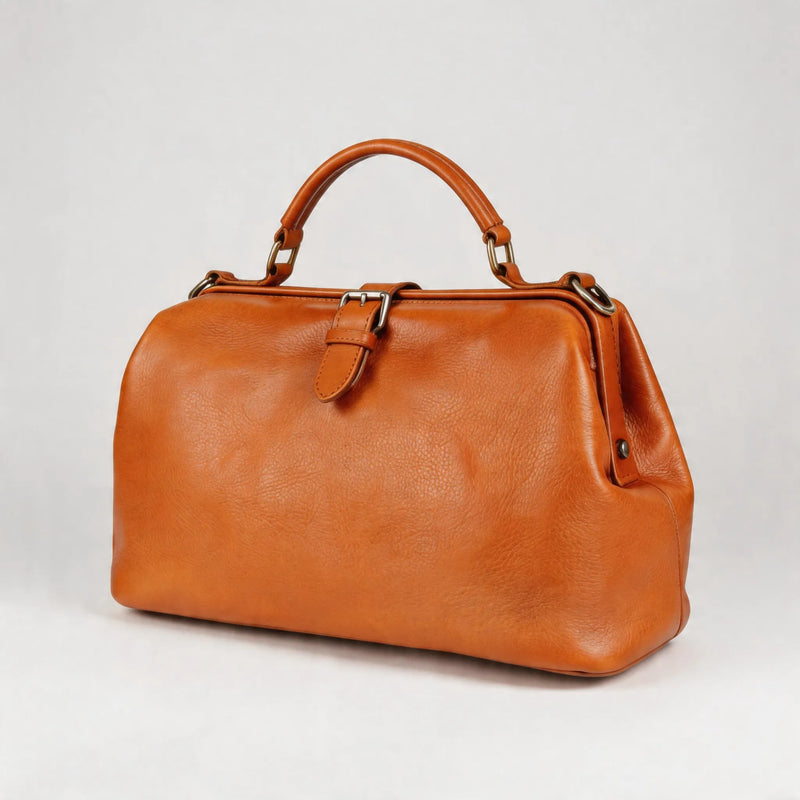 Brown leather handbag on a light gray background