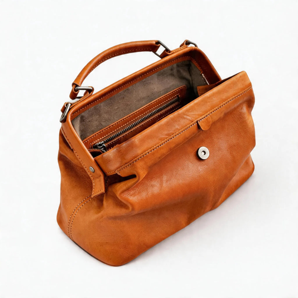 Brown leather handbag on a white background
