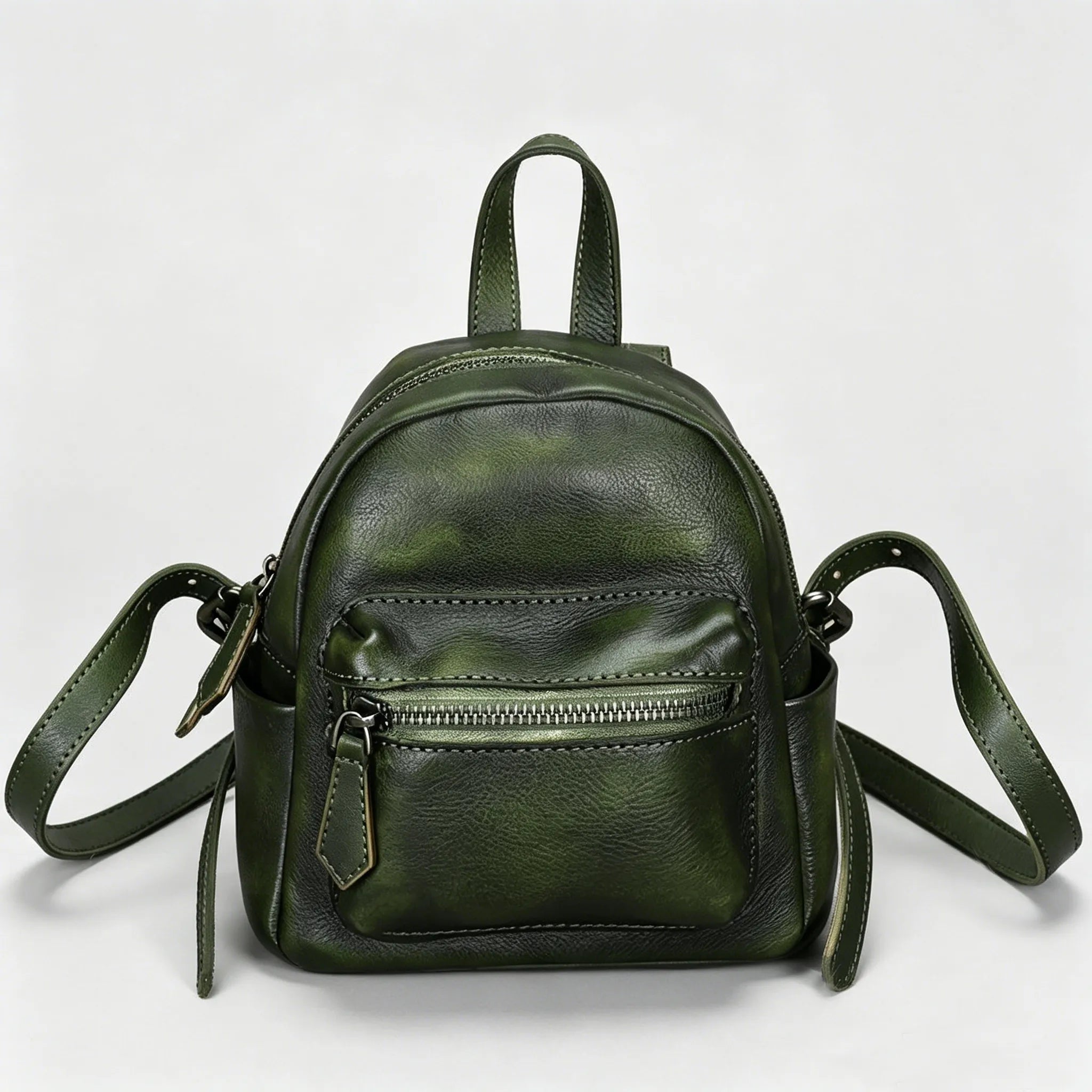 Green leather backpack on a white background