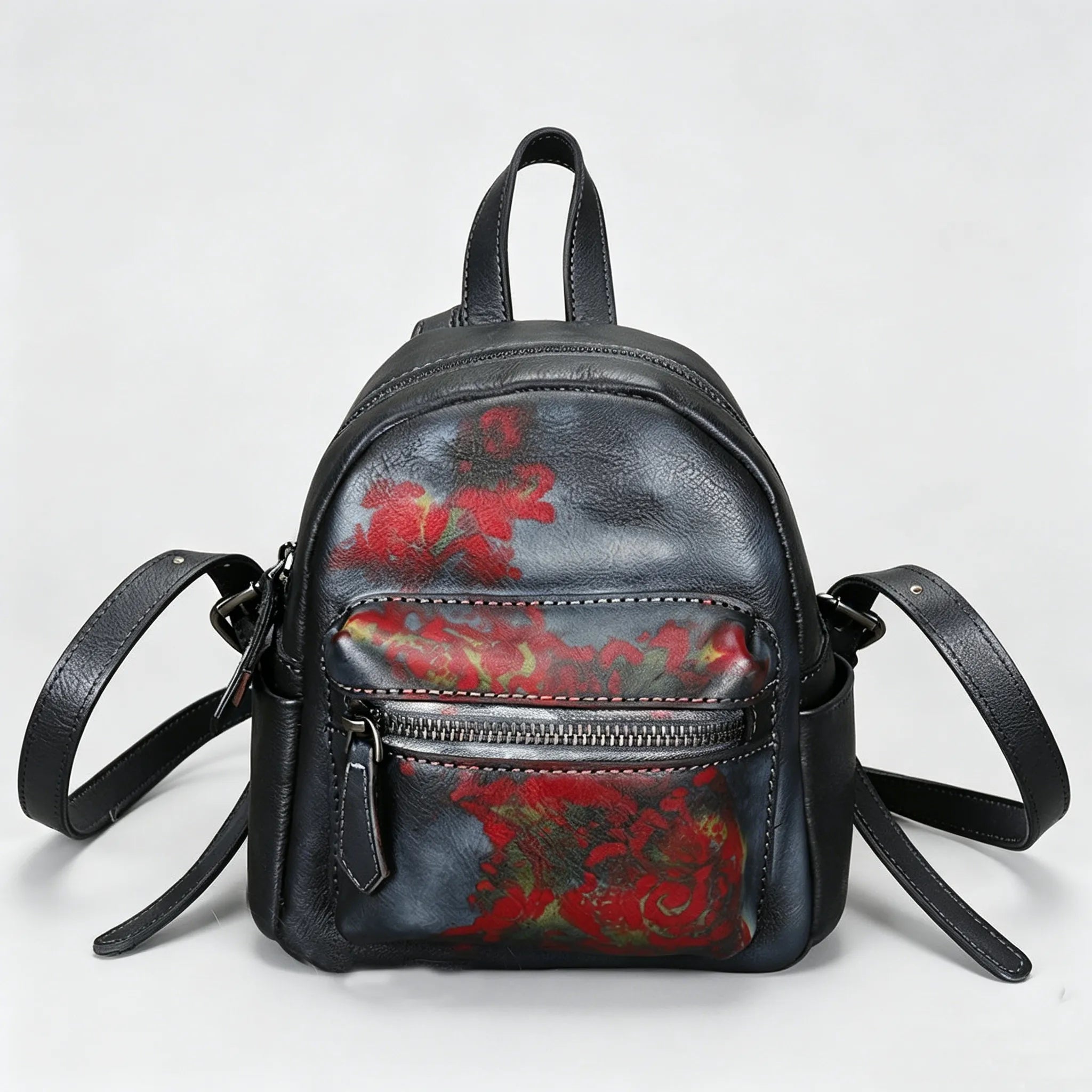 Black backpack with red floral patterns on a light gray background