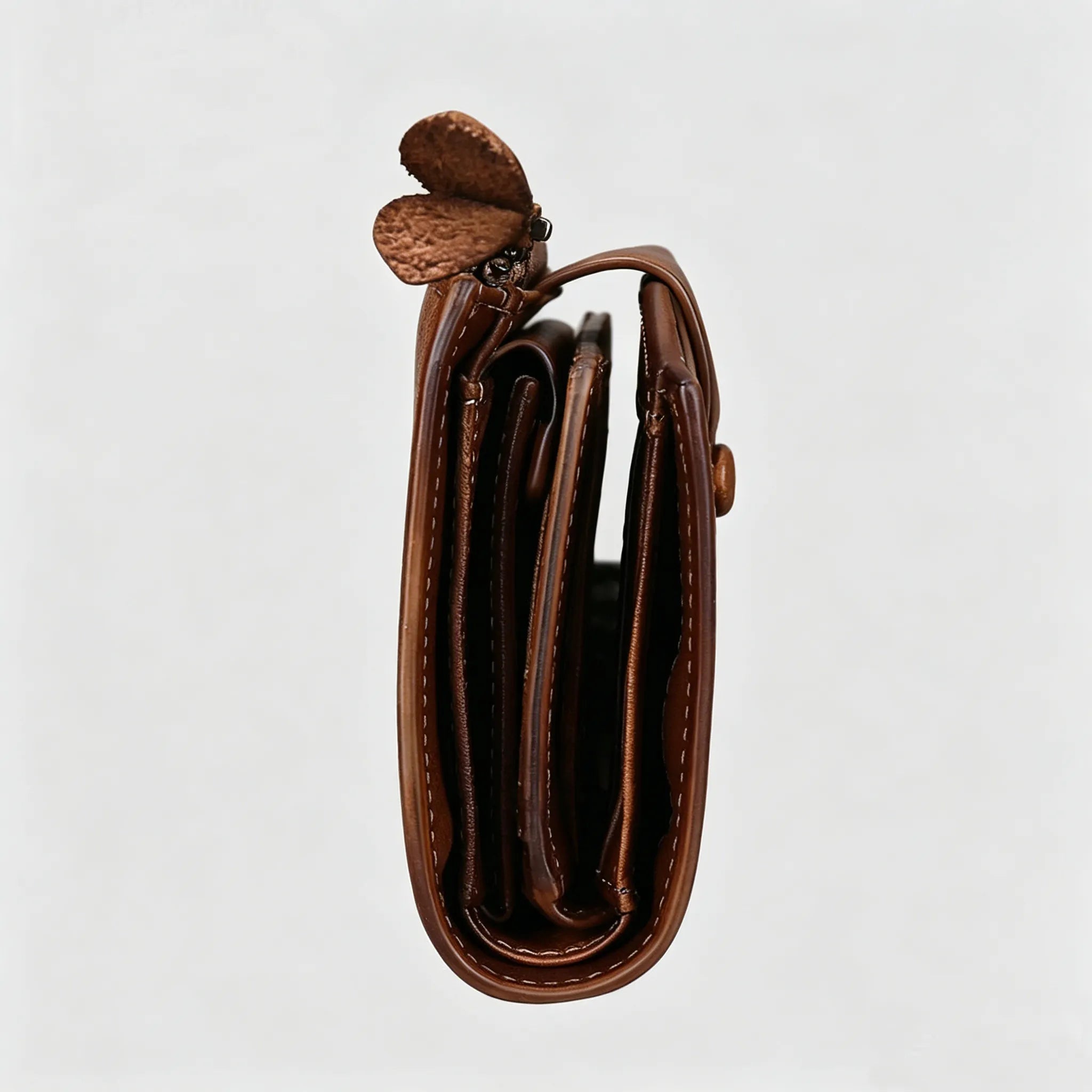 Brown leather wallet on a light gray background