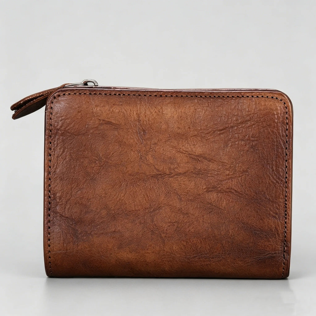 Brown leather wallet on a light gray background