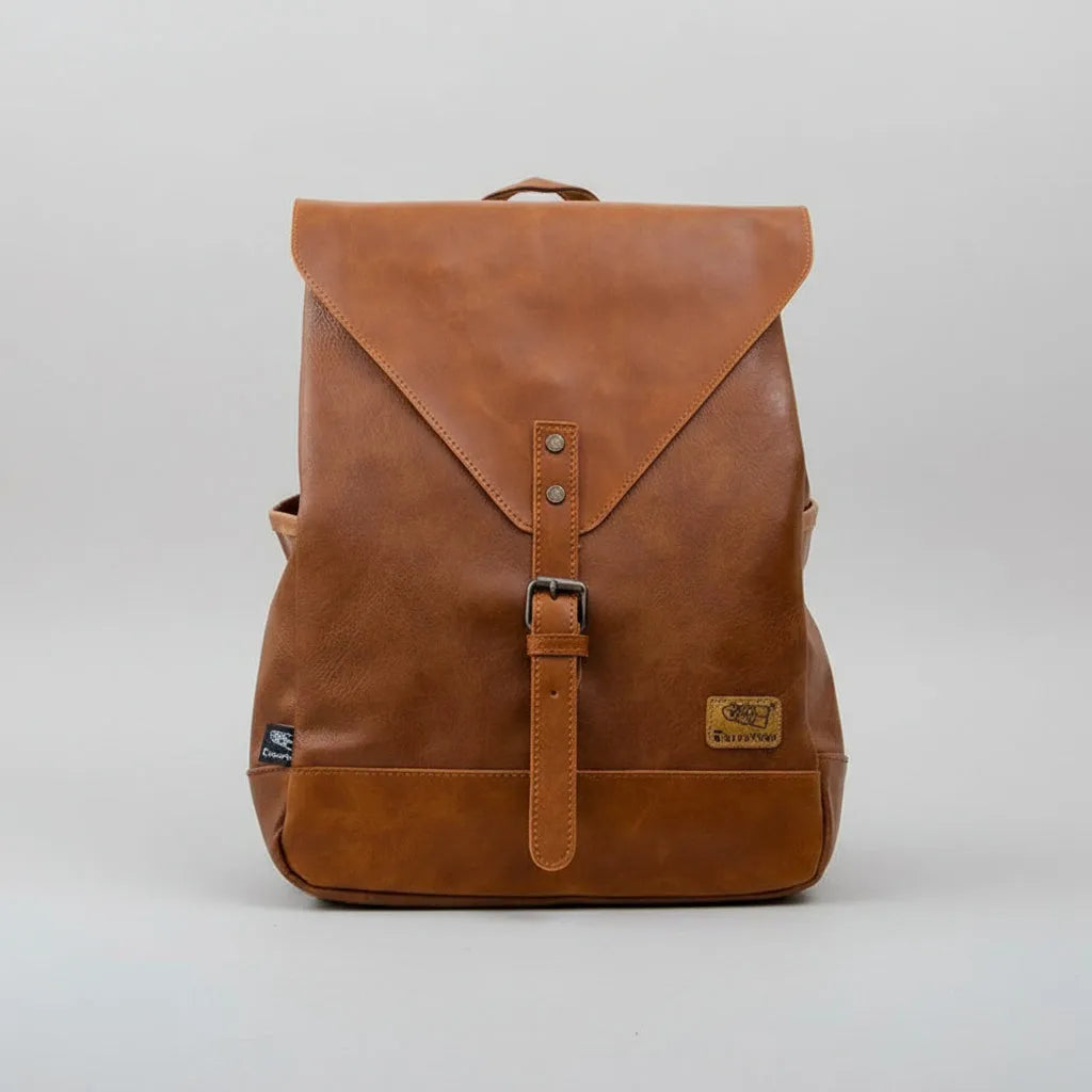 Brown leather backpack on a light gray background