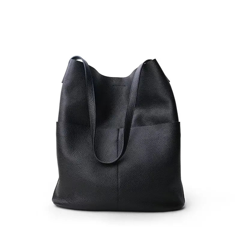 Black leather tote bag on a white background