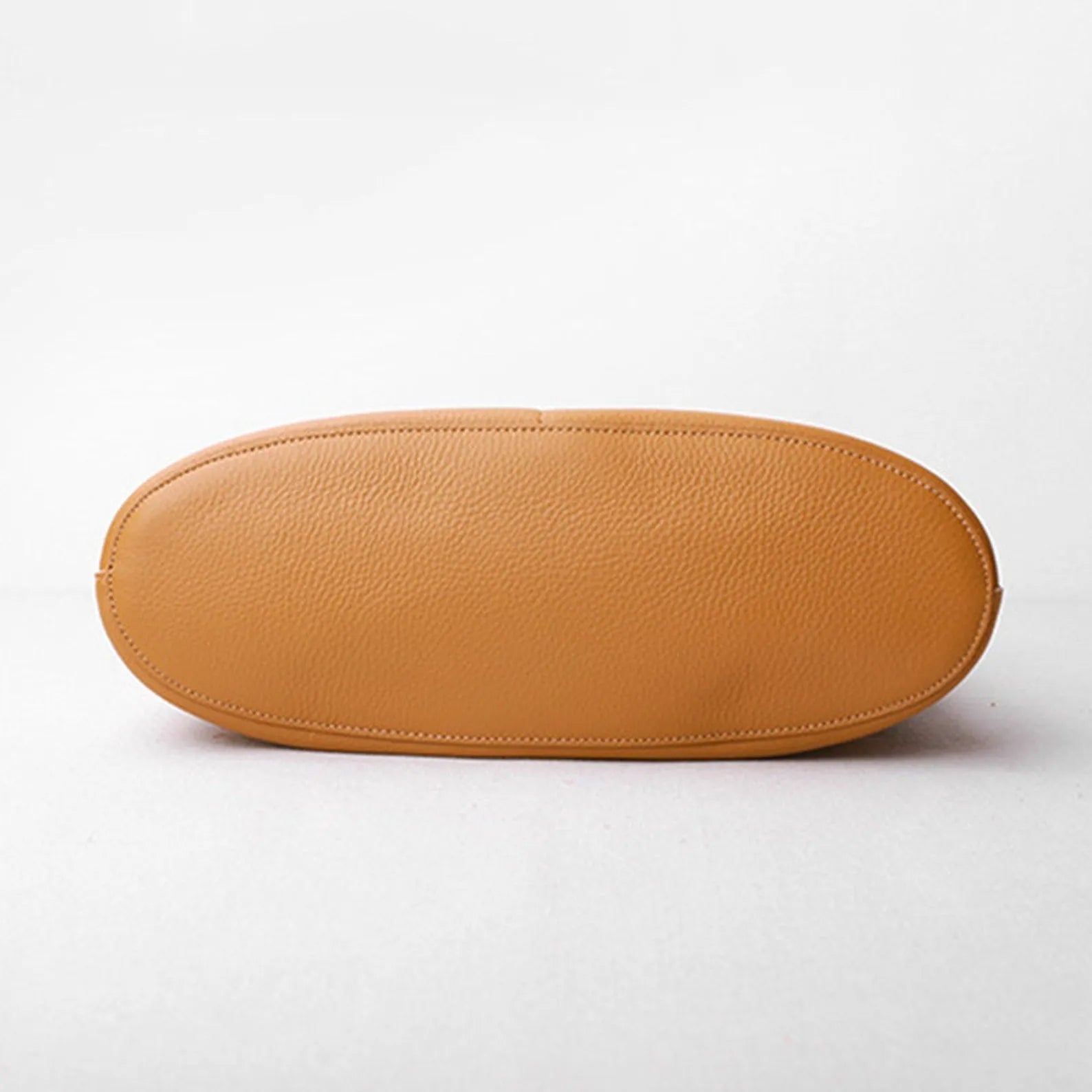 Brown leather case on a white background