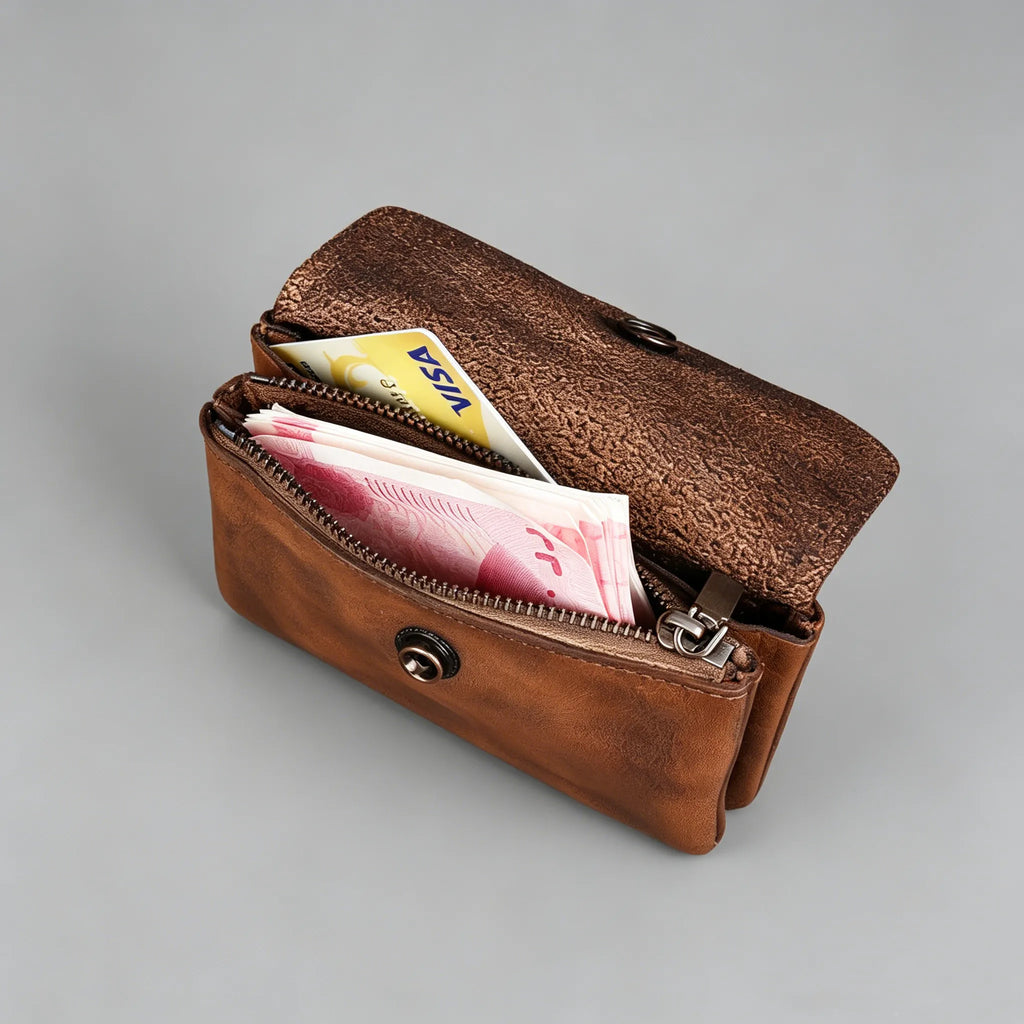 Brown leather wallet with money and a card on a gray background