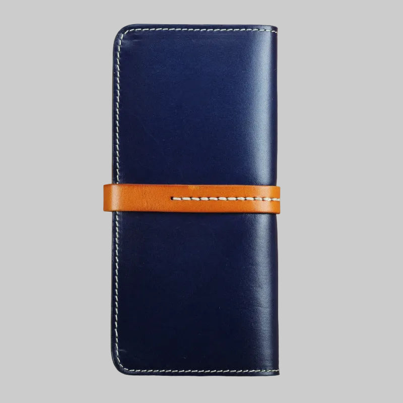 Blue leather phone case with an orange strap on a brown background