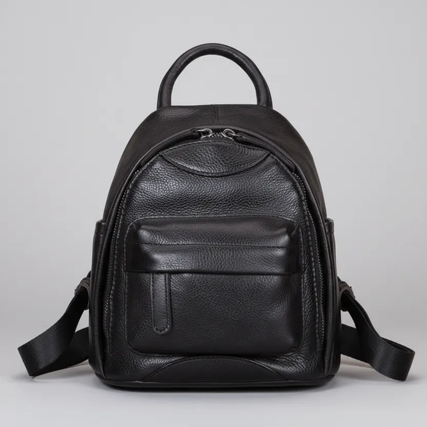 Black leather backpack on a light gray background