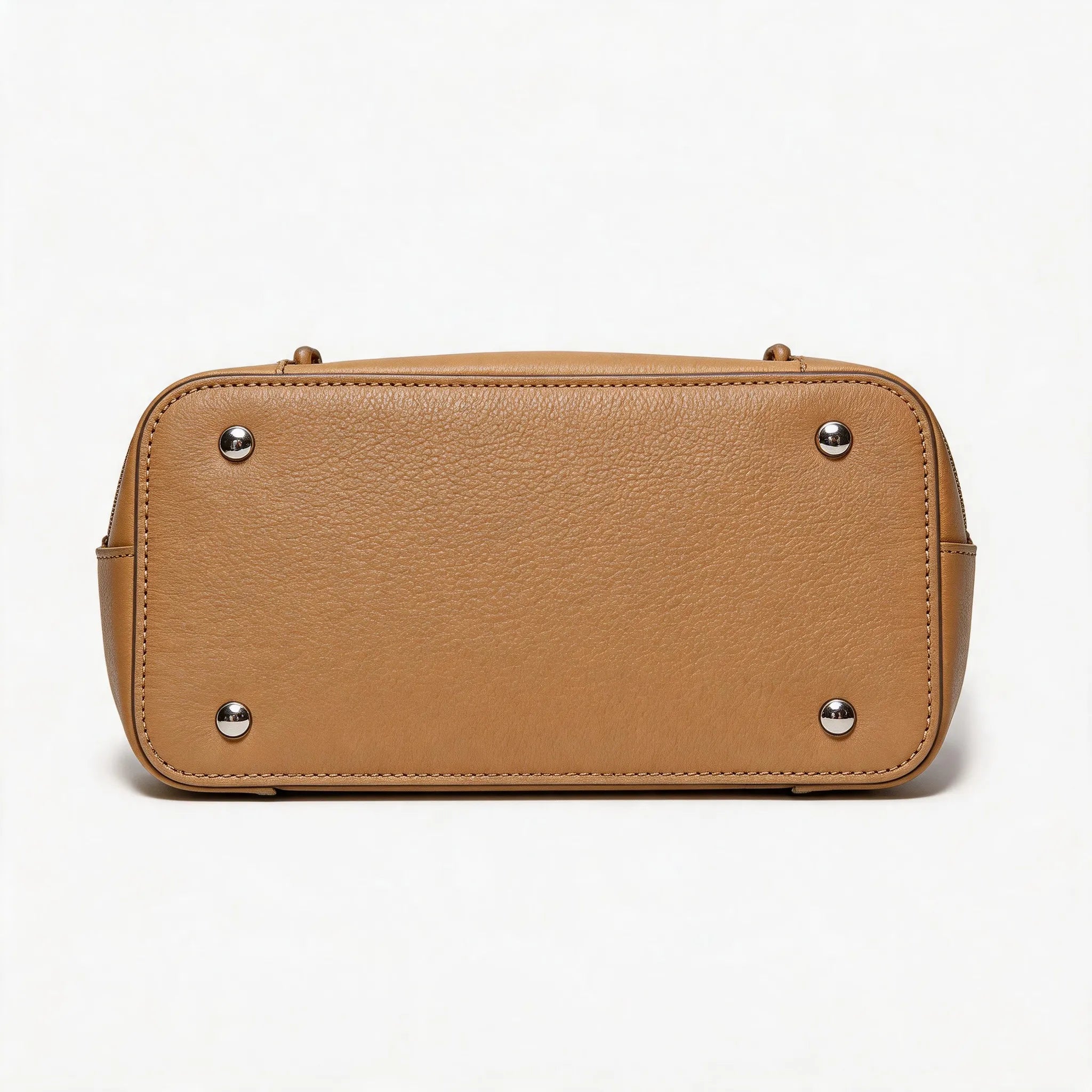 Tan leather handbag with silver studs on a white background