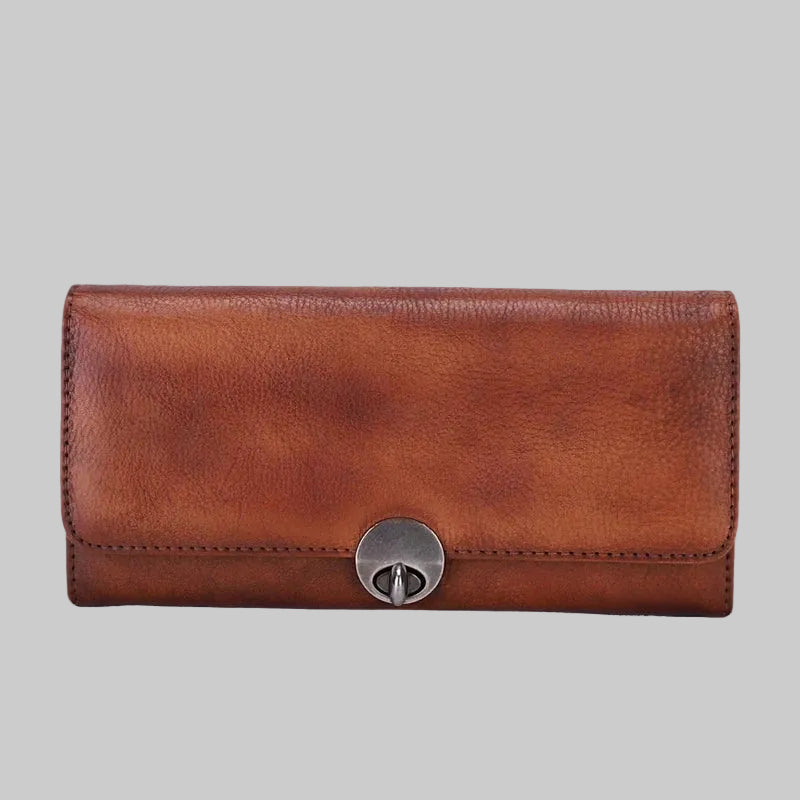 Brown leather wallet with a silver clasp on a white background