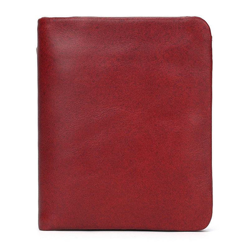 Red leather notebook on a white background