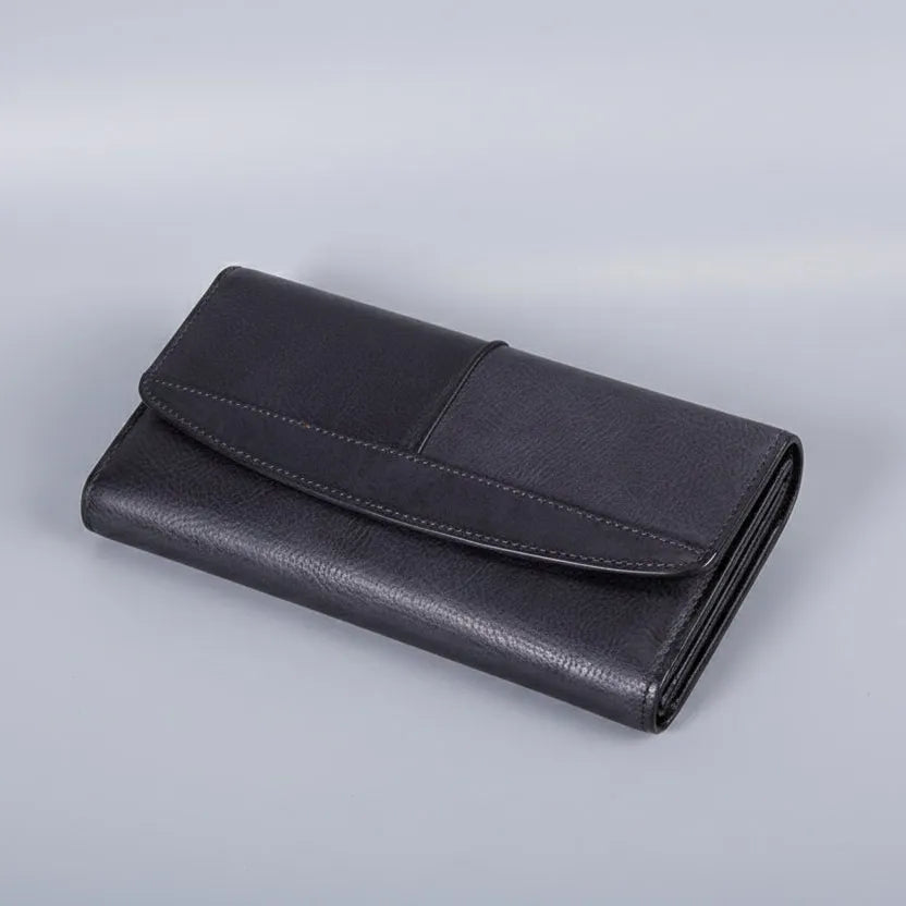 Black leather wallet on a light gray background