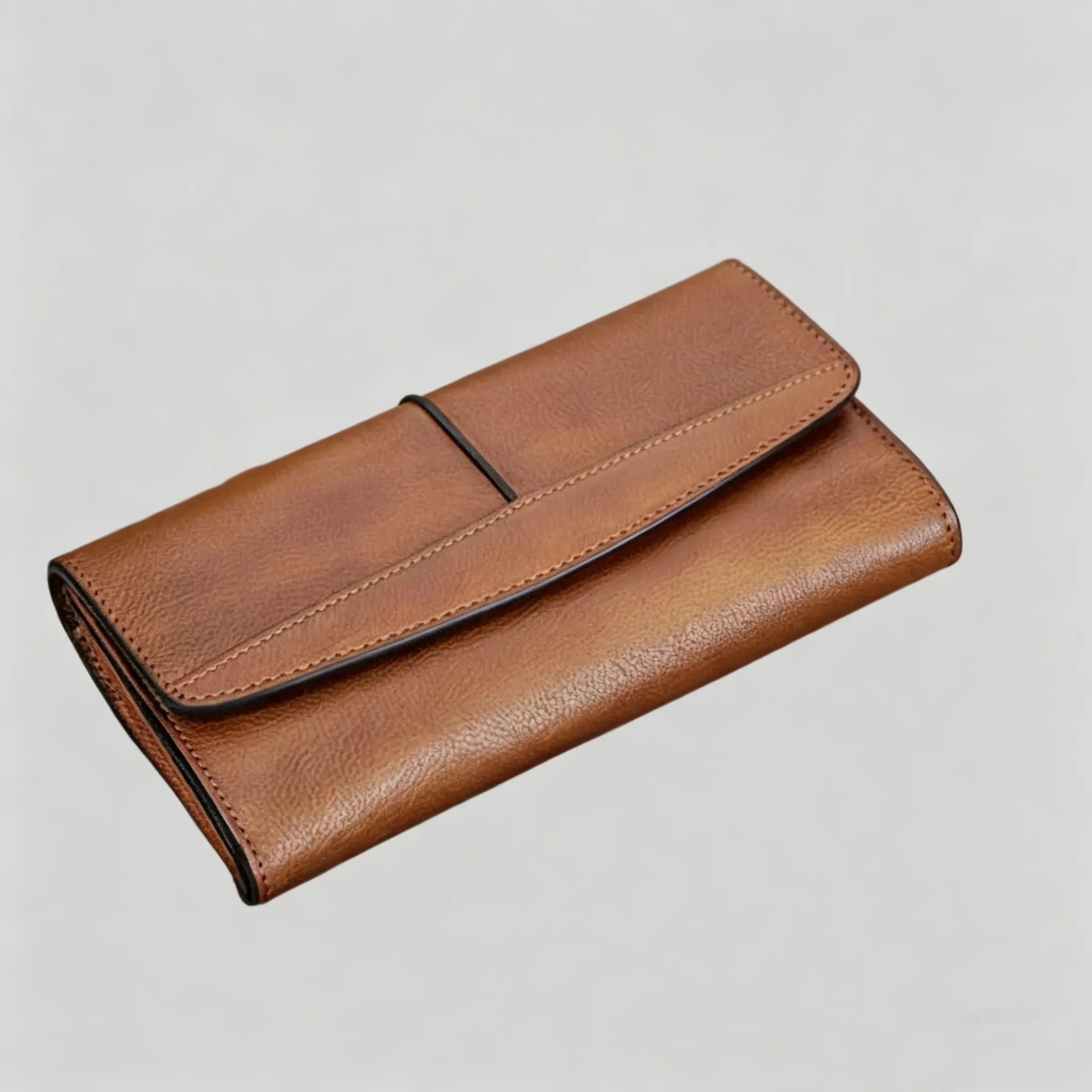 Brown leather wallet on a light gray background