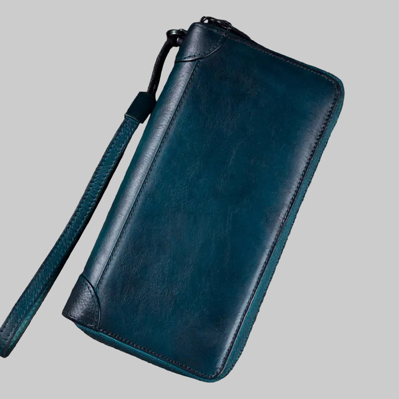 Blue leather wallet with a strap on a gray background