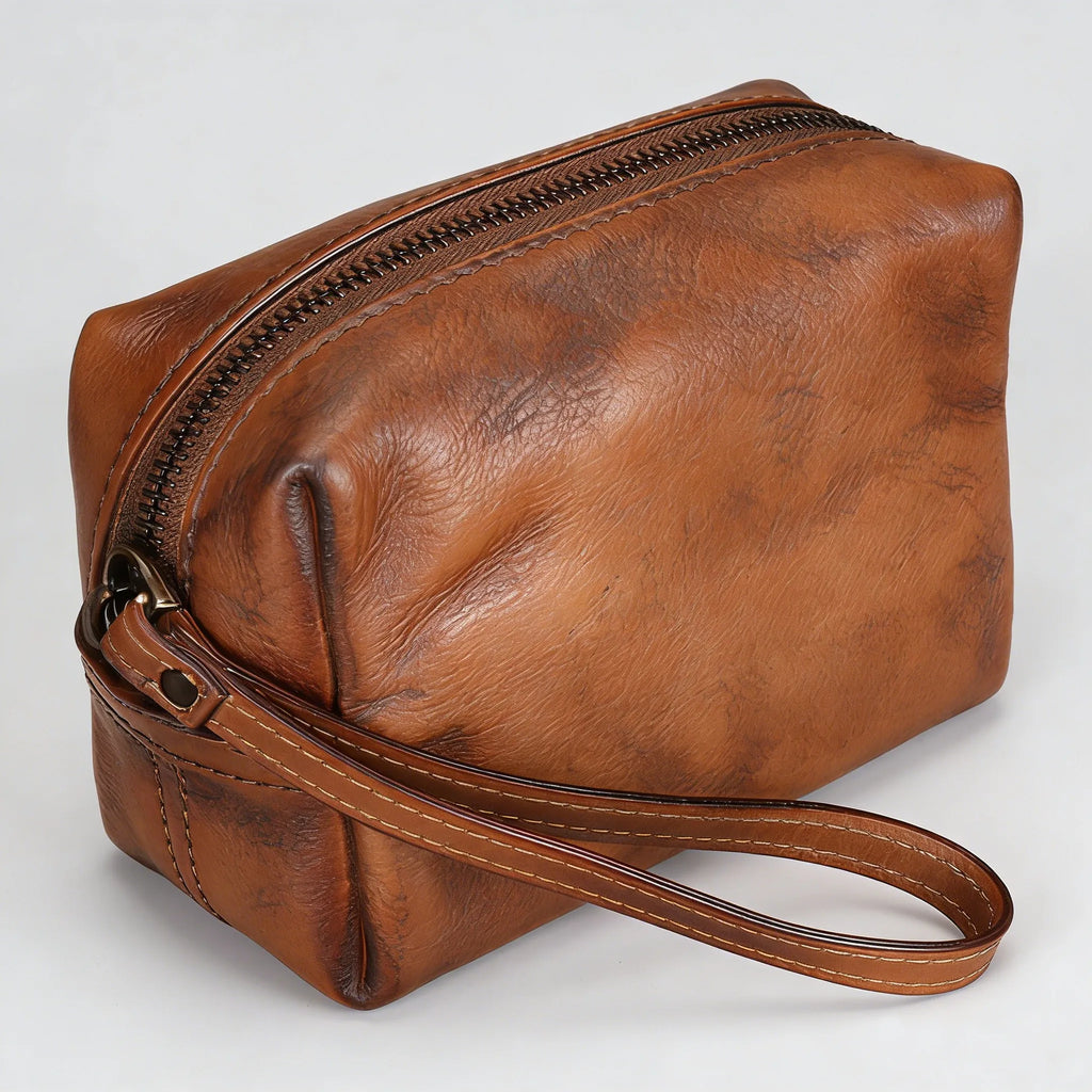 Brown leather pouch with a strap on a white background