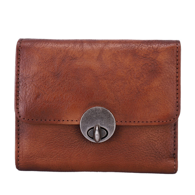 Brown leather wallet with a silver clasp on a white background