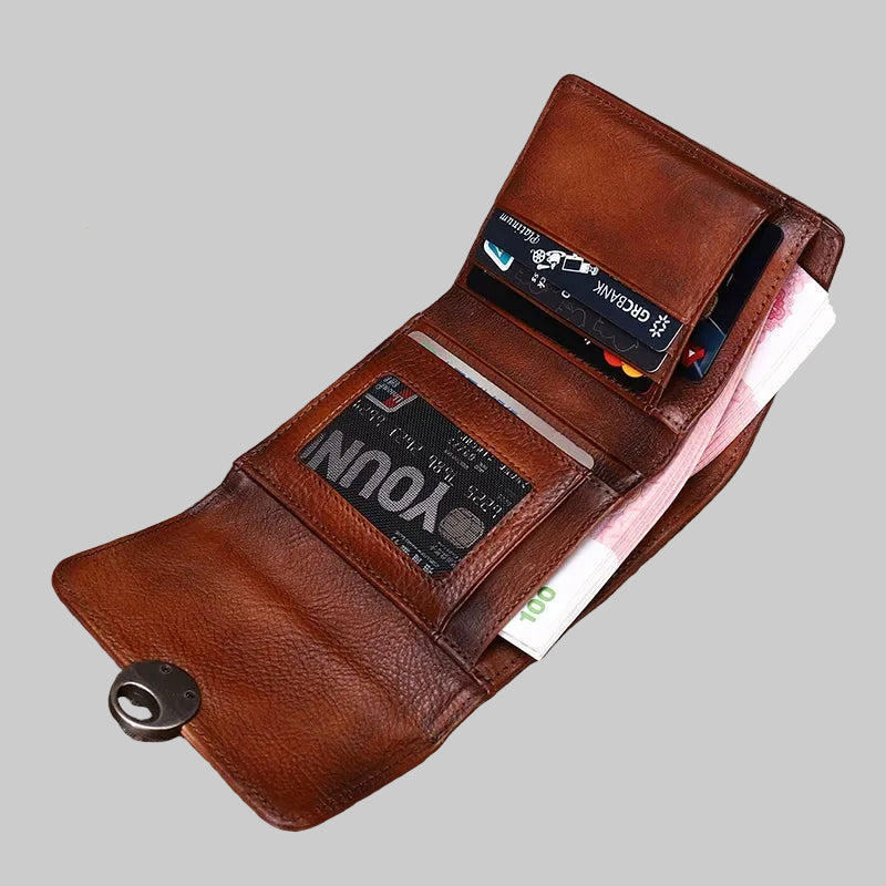 Brown leather wallet with cards and money on a wooden surface