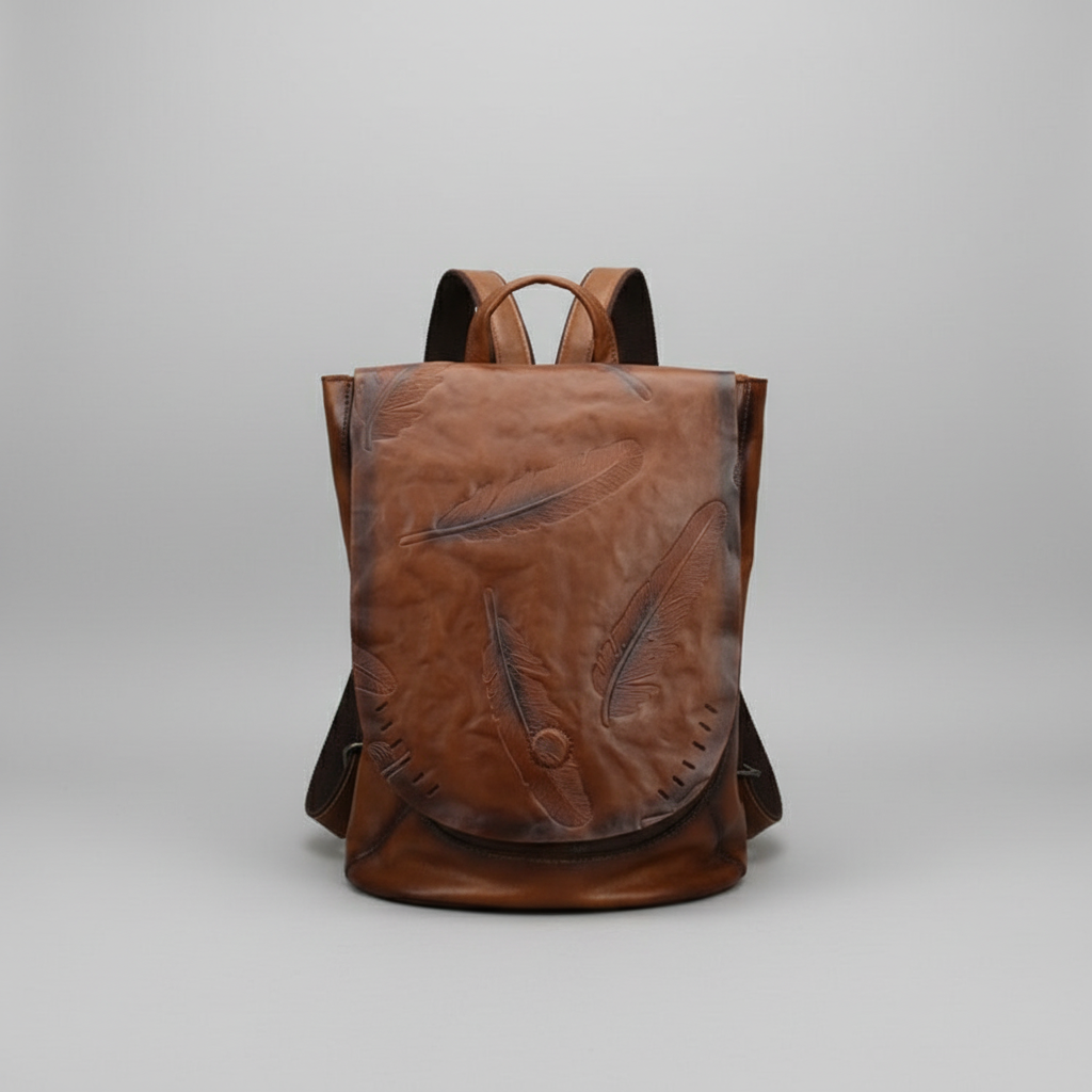 Brown leather backpack on a light gray background