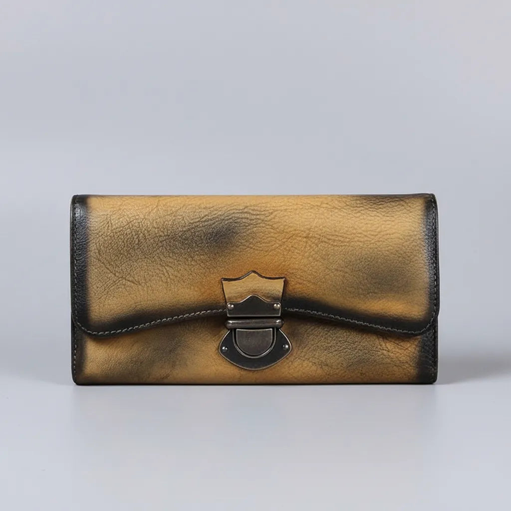 Gold and black wallet on a gray background