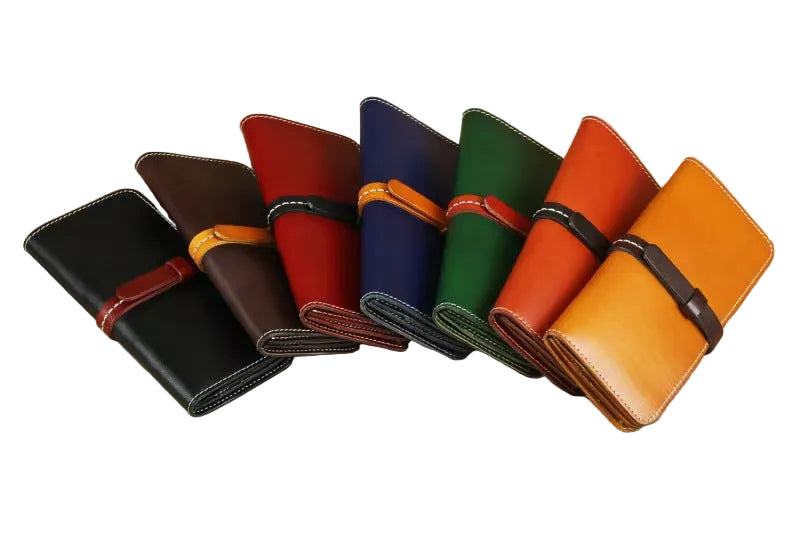 Fanned display of handmade full grain leather long wallets in 7 colors, genuine leather purse with strap closure