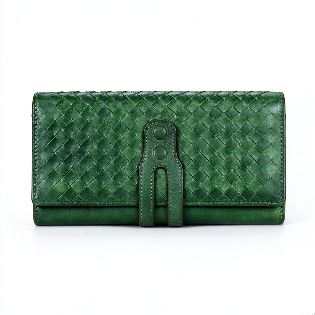 Straight front view of green hand woven genuine leather long wallet, double snap strap detail, white product background