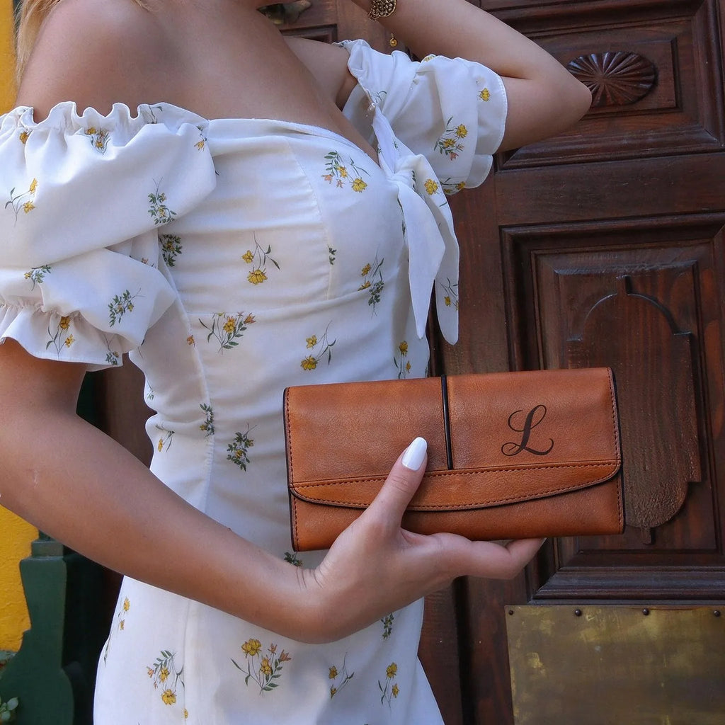 Brown full grain leather clutch wallet with engraved monogram letter L, woman holding personalized leather purse, handmade leather wallet for women