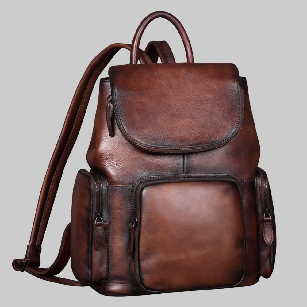 Brown leather backpack on a light gray background