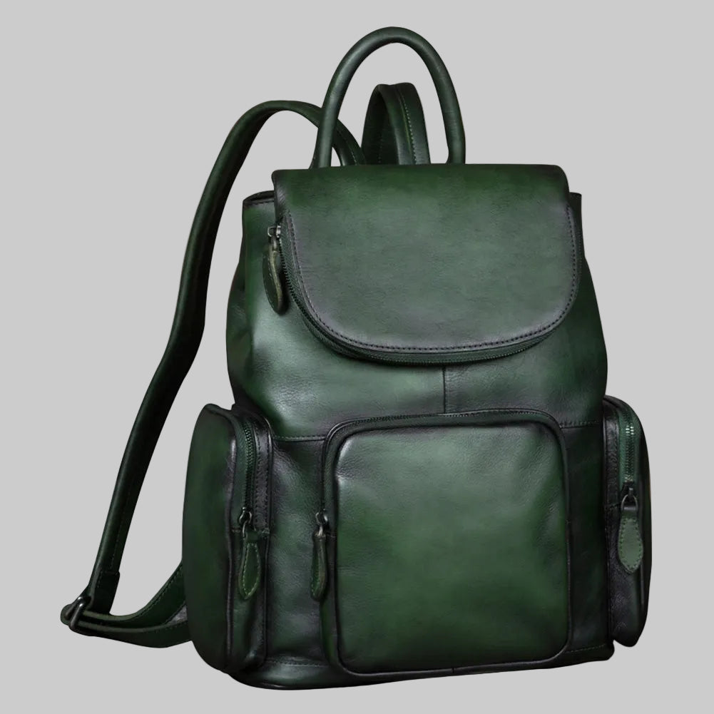 Green leather backpack on a light gray background
