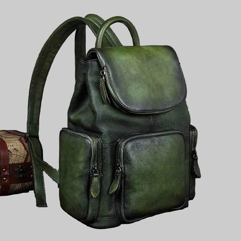 Green leather backpack on a light gray background