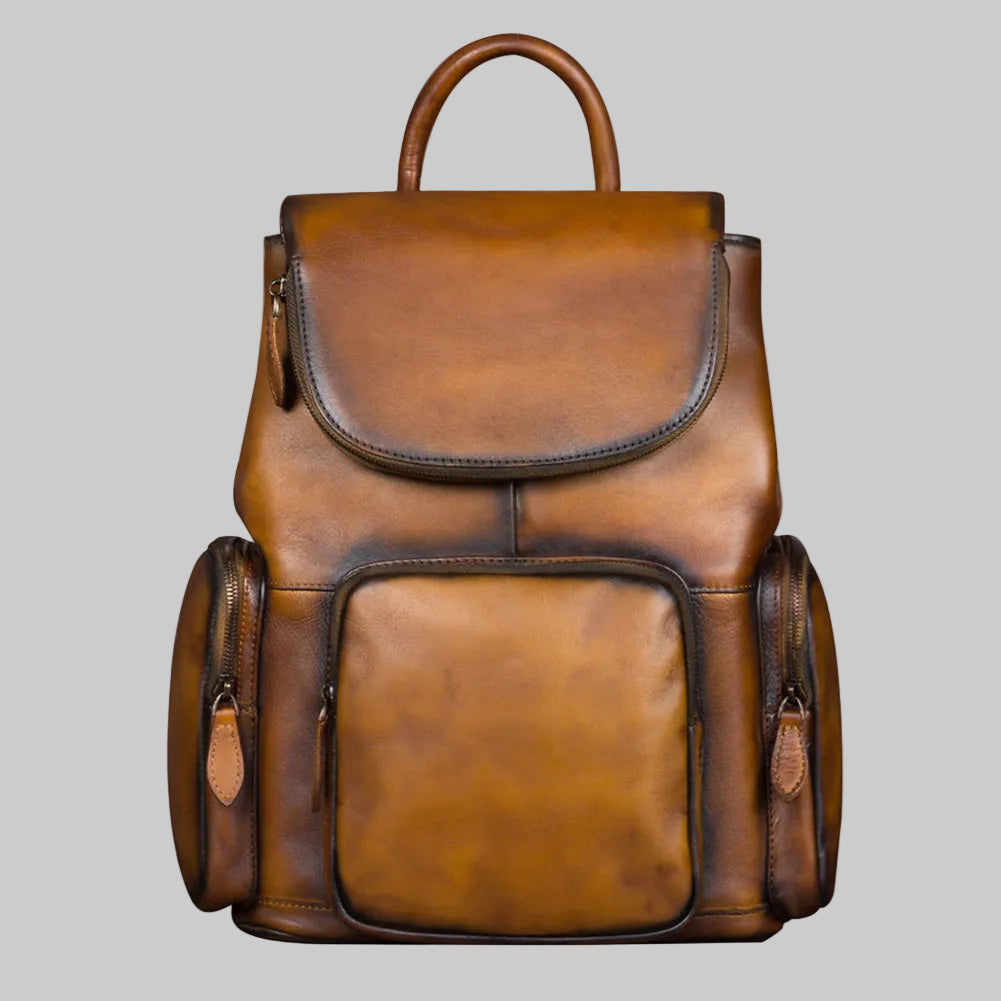 Brown leather backpack on a gray background