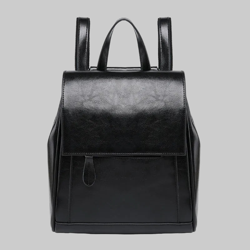 Black backpack on a light gray background
