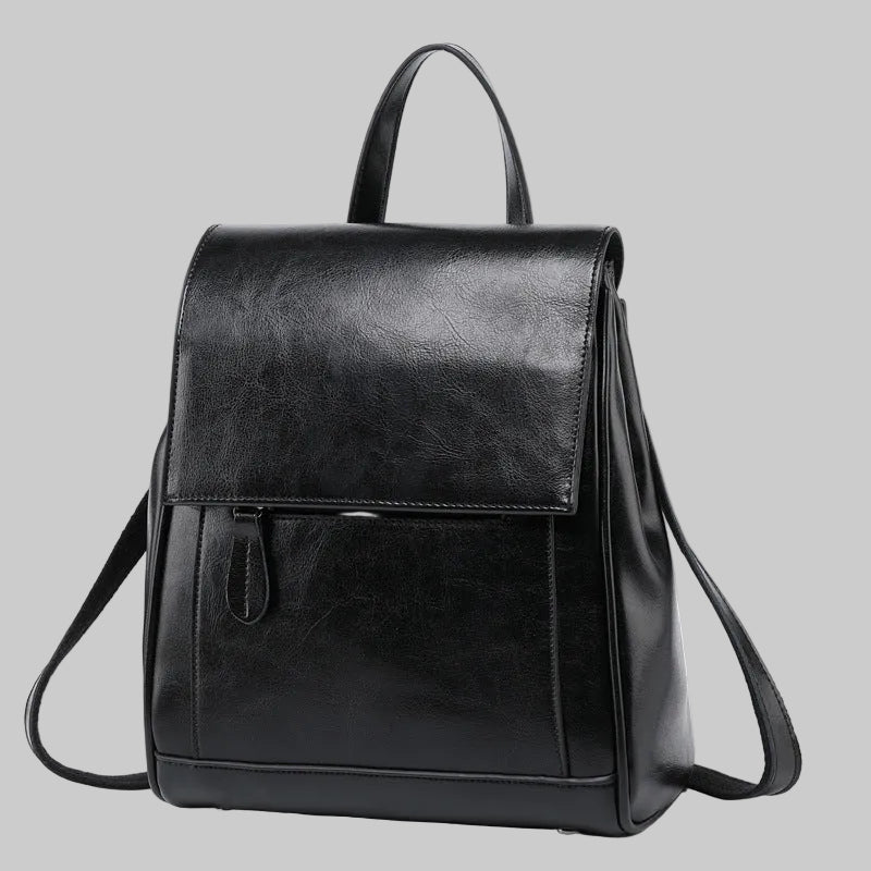 Black leather backpack on a white background