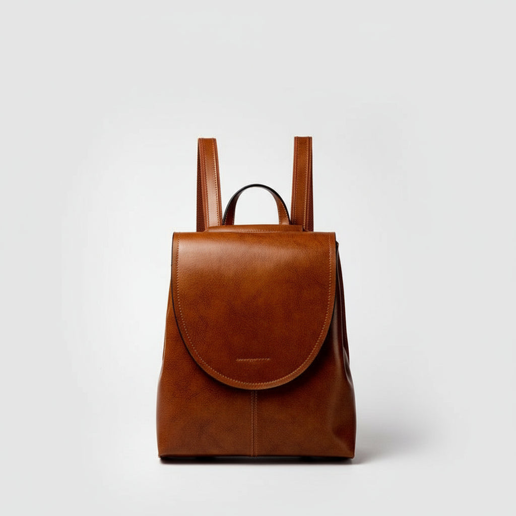 Brown leather backpack on a light gray background