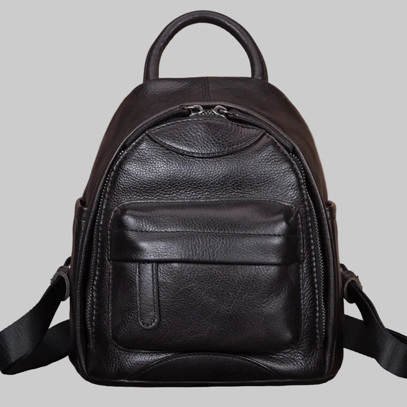Black leather backpack on a light gray background