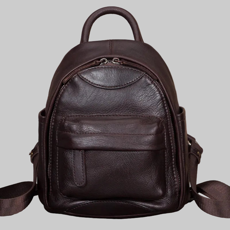 Brown leather backpack on a light gray background