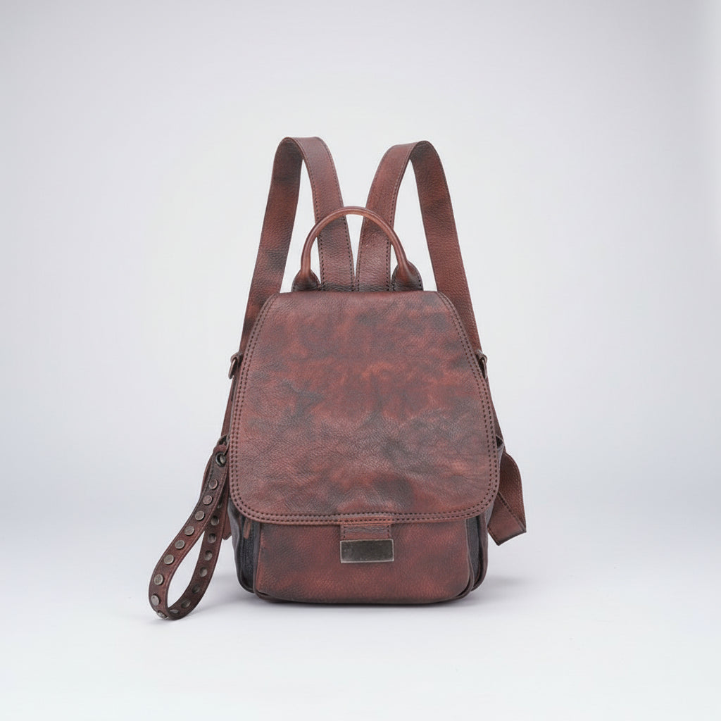Brown leather backpack on a white background