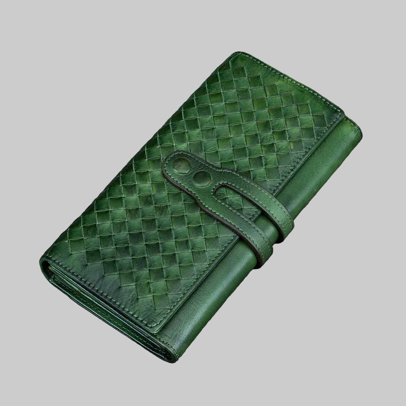Green woven leather wallet on a gray background