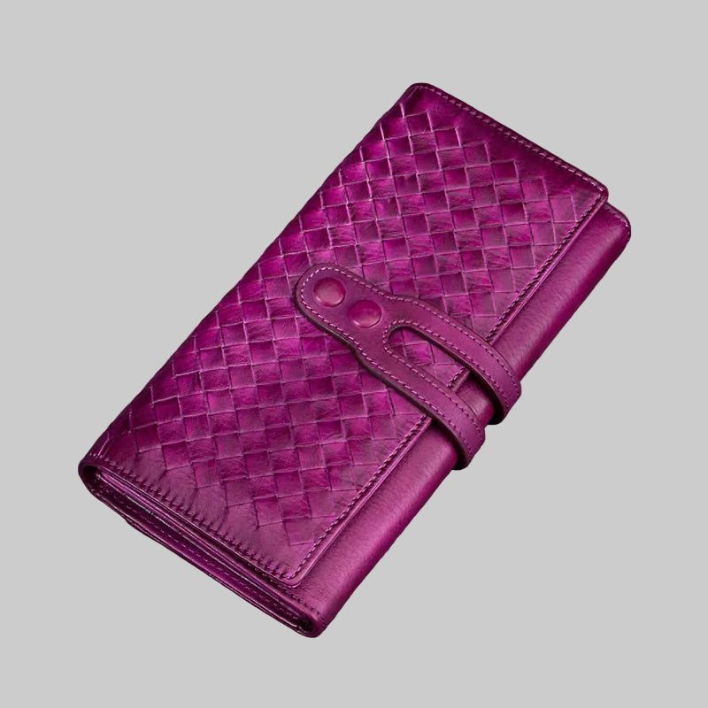Purple woven wallet on a gray background
