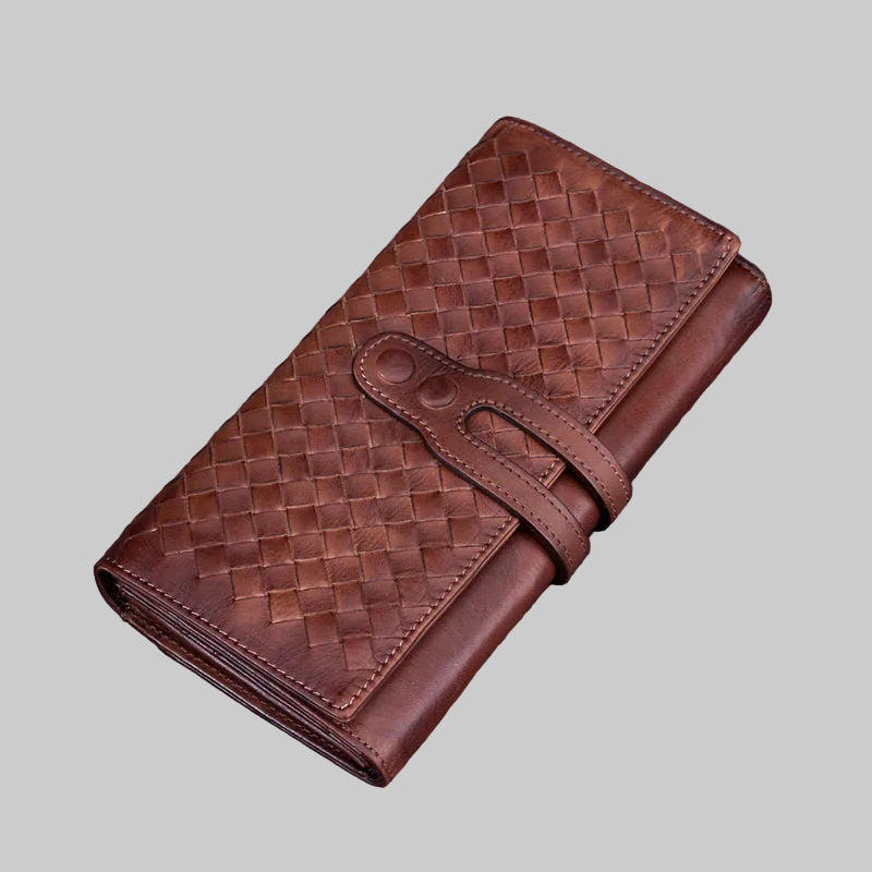 Brown woven leather wallet on a light gray background