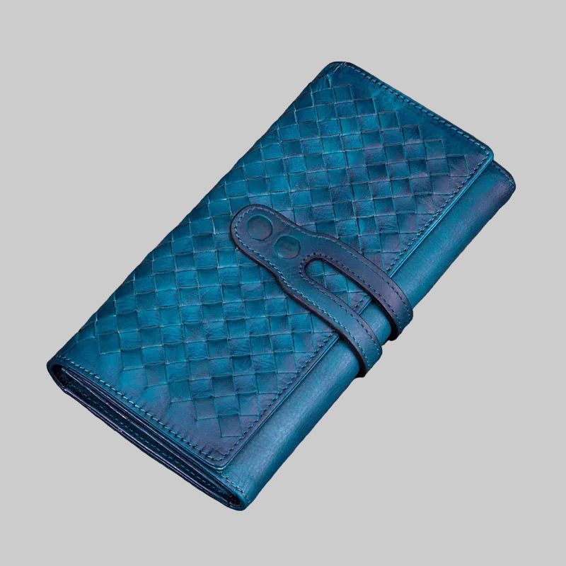 Blue woven leather wallet on a gray background