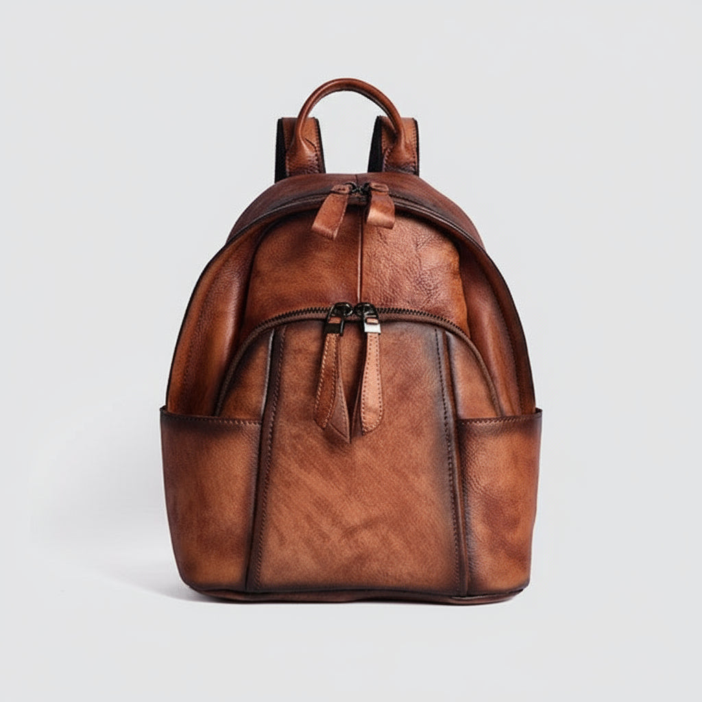 Brown leather backpack on a light gray background